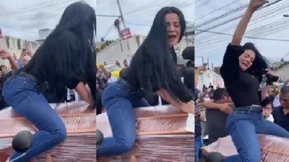 Viuda perrea en cajón de su marido en el entierro